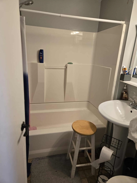 78 San Miguel Street Springfield, MA 01104 - Photo 18 of 26 a bathroom with a sink toilet a mirror and shower