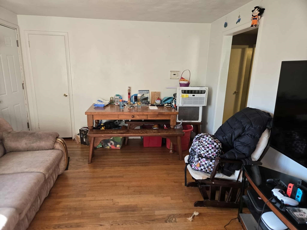 78 San Miguel Street Springfield, MA 01104 - Photo 21 of 26 a living room with furniture and a fireplace