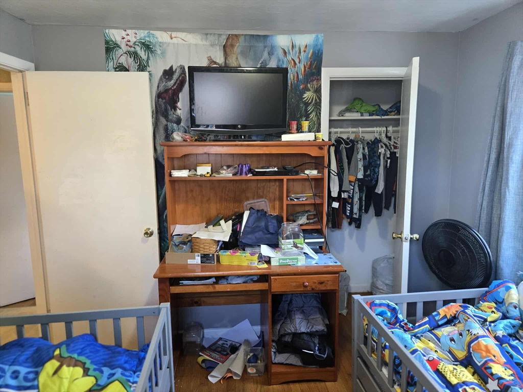 78 San Miguel Street Springfield, MA 01104 - Photo 22 of 26 a room with furniture and a flat screen tv