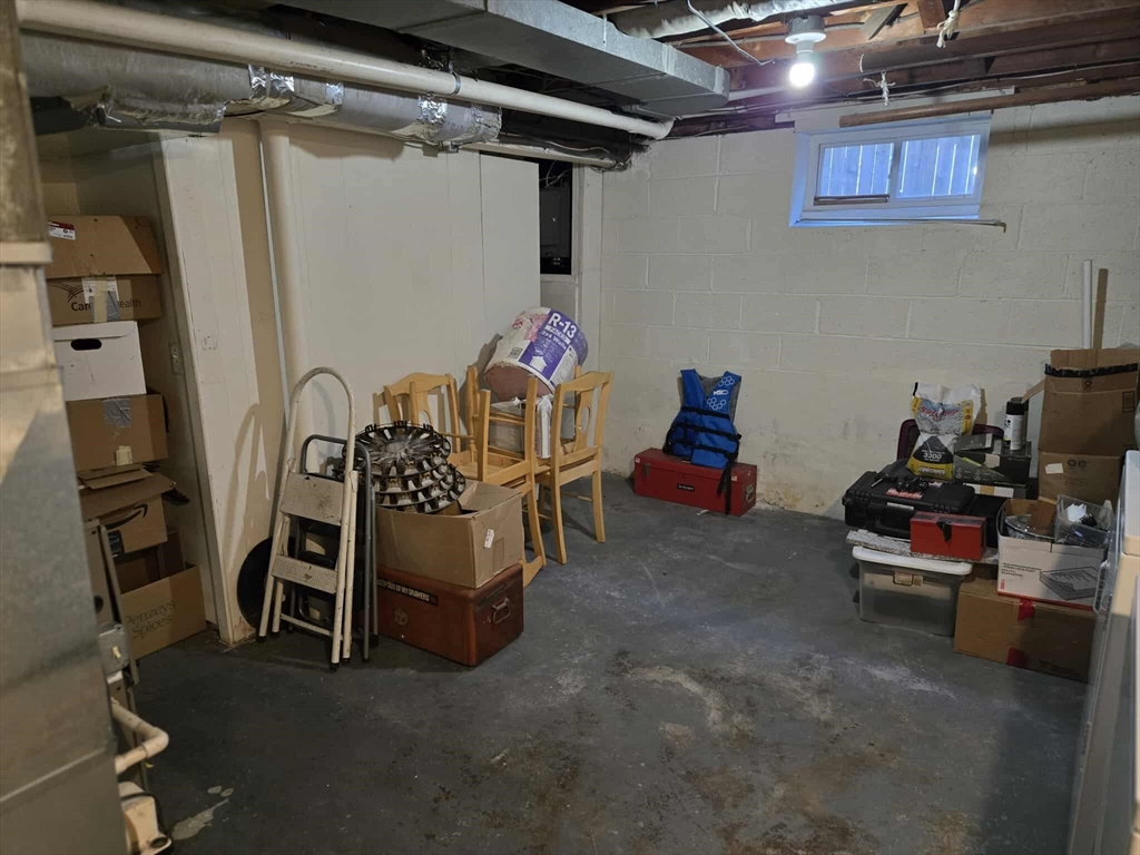 78 San Miguel Street Springfield, MA 01104 - Photo 23 of 26 a bedroom with furniture and a chair