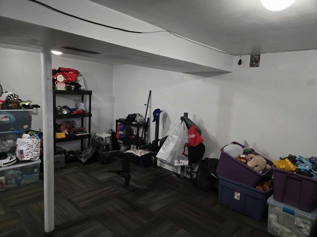 78 San Miguel Street Springfield, MA 01104 - Photo 24 of 26 a room with gym equipment and wooden floor
