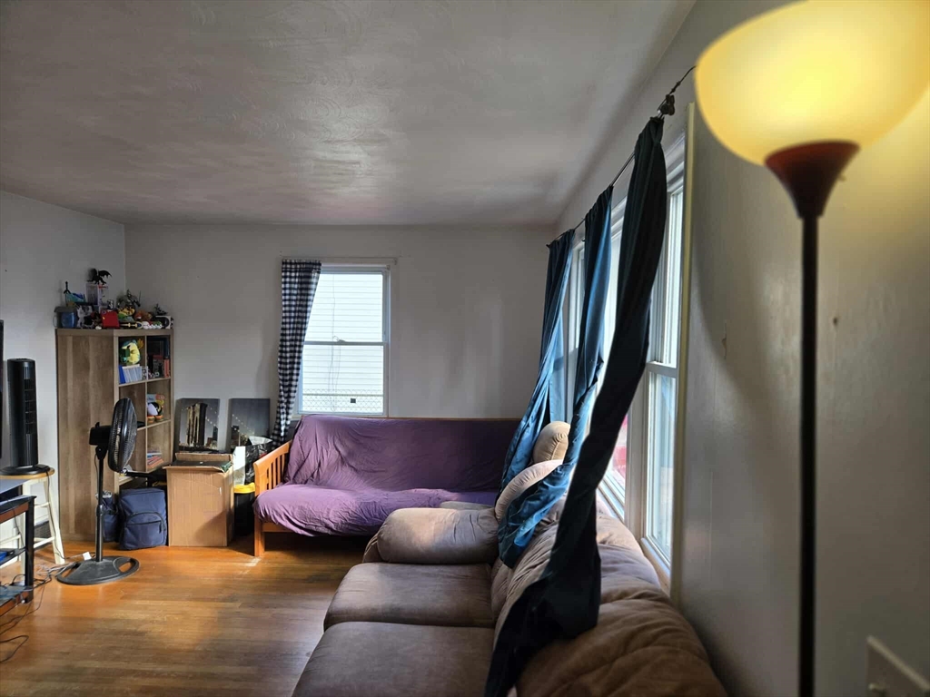 78 San Miguel Street Springfield, MA 01104 - Photo 26 of 26 a living room with furniture and a window