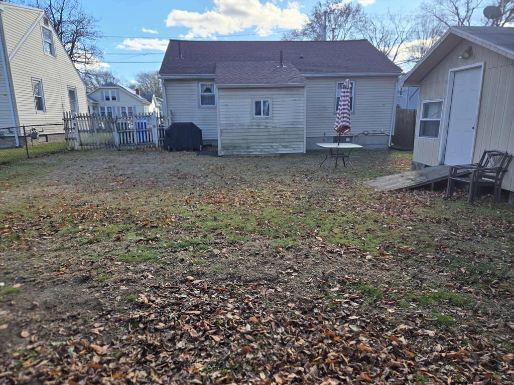 78 San Miguel Street Springfield, MA 01104 - Photo 3 of 26 a view of a house with a yard