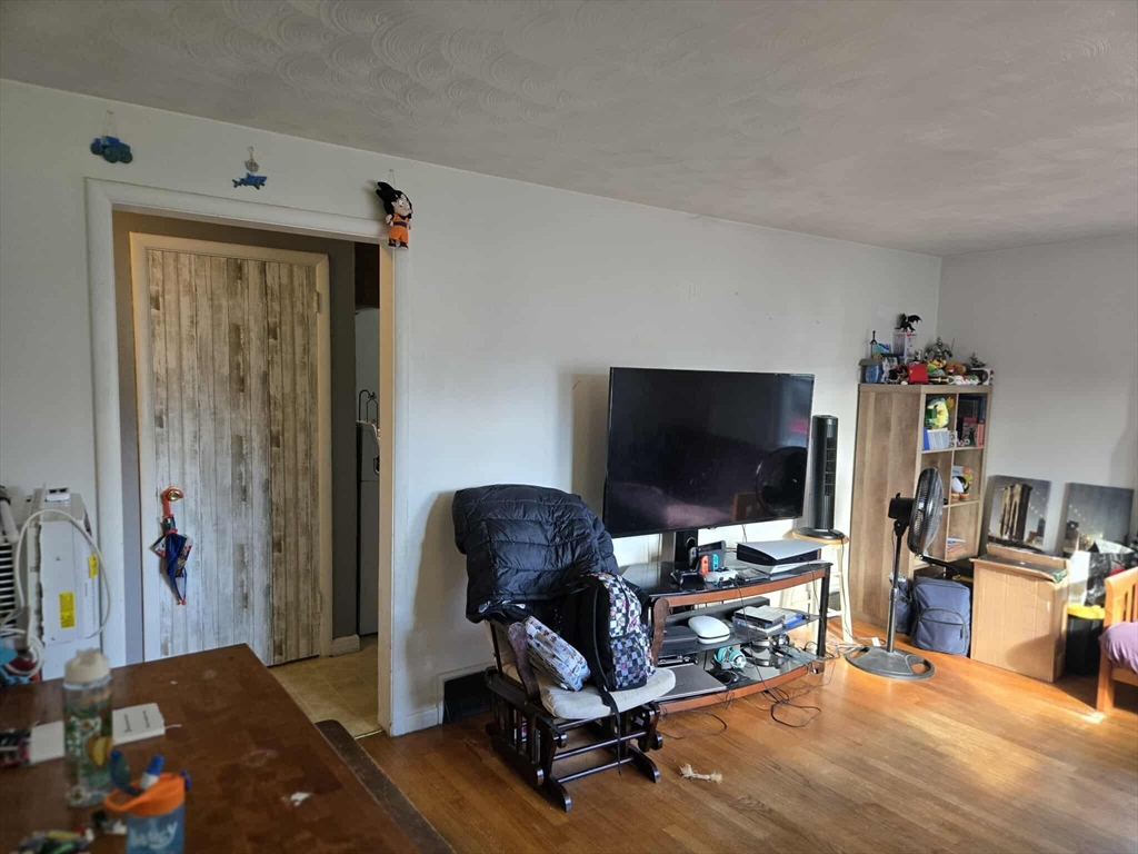 78 San Miguel Street Springfield, MA 01104 - Photo 6 of 26 a living room with furniture and a flat screen tv
