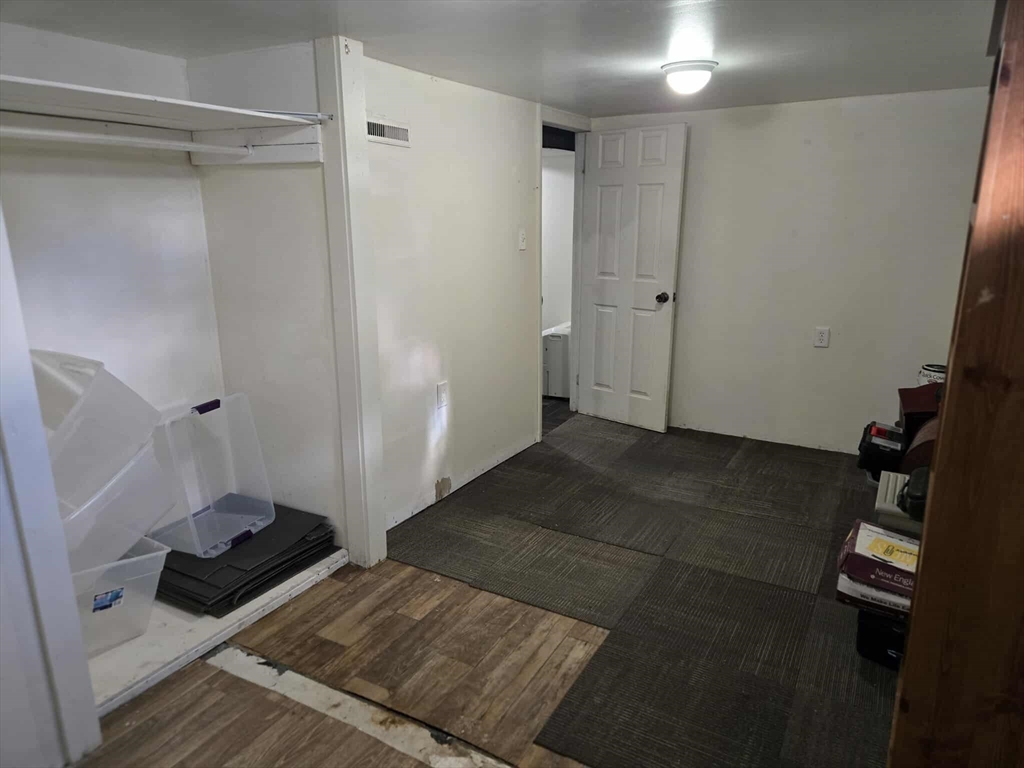 78 San Miguel Street Springfield, MA 01104 - Photo 10 of 26 a bedroom with a bed and a window