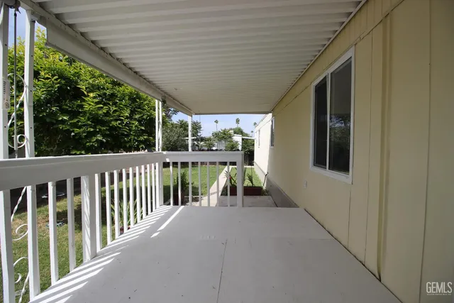 a view of a porch with wooden floor and outdoor space