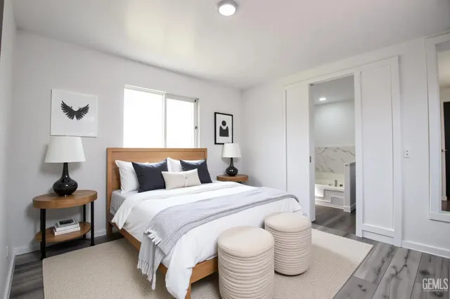 a bedroom with a bed and a lamp