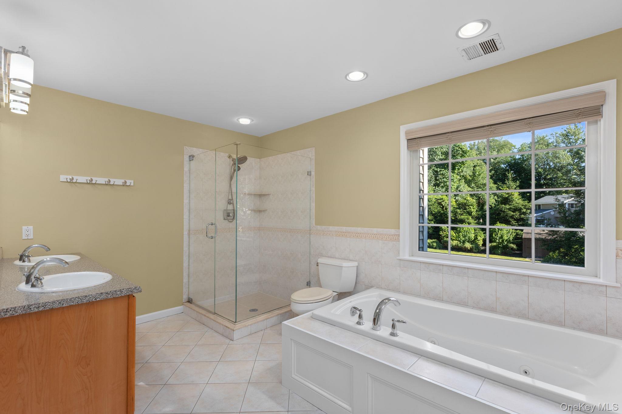 2211 Crompond Road Yorktown Heights, NY 10598 - Photo 16 of 38 a bathroom with a tub sink and shower