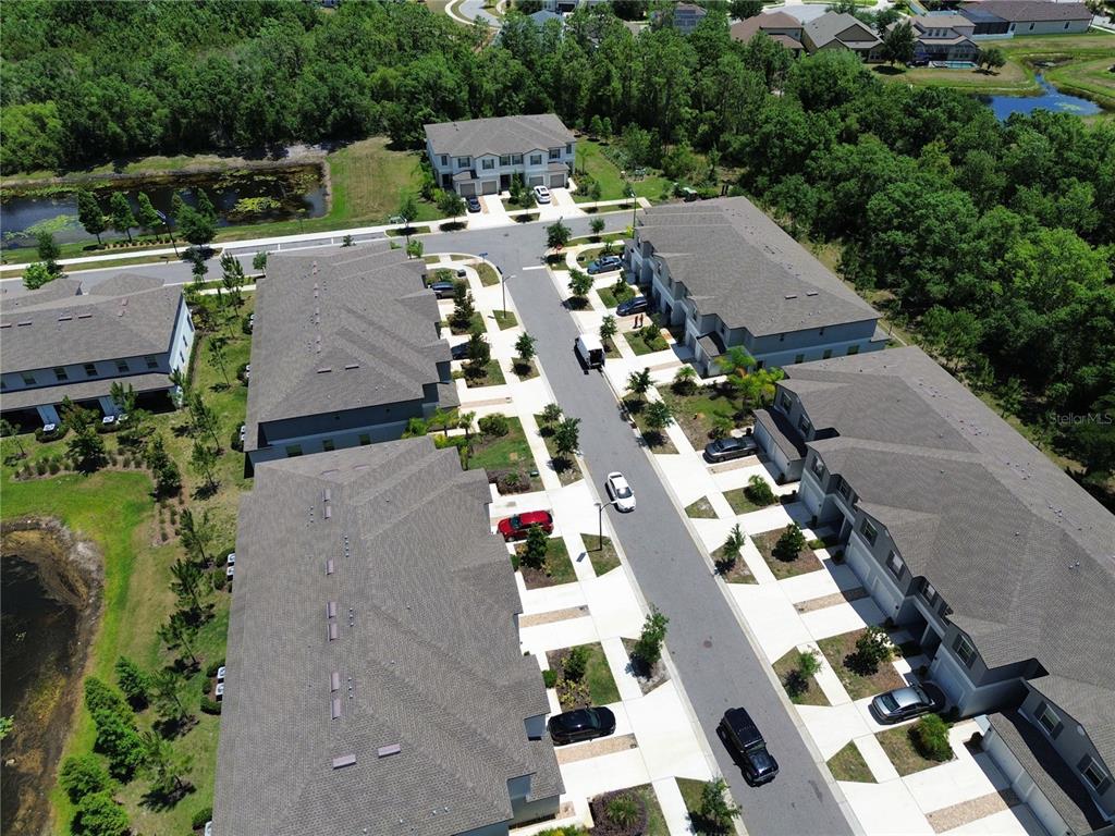 11826 Dumaine Valley Road Riverview, FL 33579 - Photo 41 of 54 an aerial view of multiple houses with yard