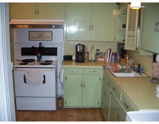 a view of a kitchen with appliances and cabinets