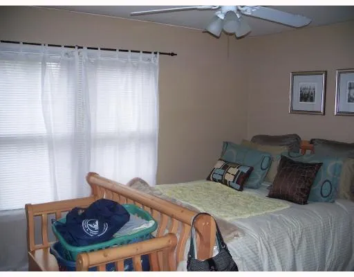 a bedroom with a bed and dresser