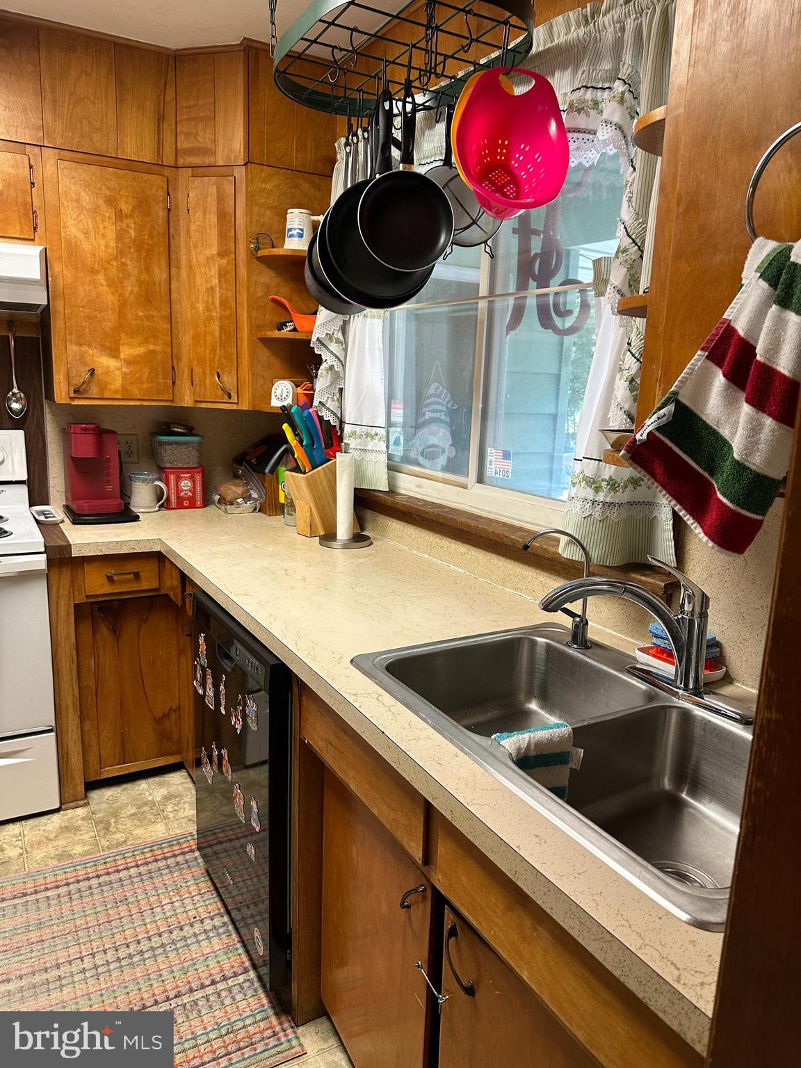 160 Silver Lake Road Bridgeton, NJ 08302 - Photo 12 of 28 a kitchen with a sink a stove and a microwave