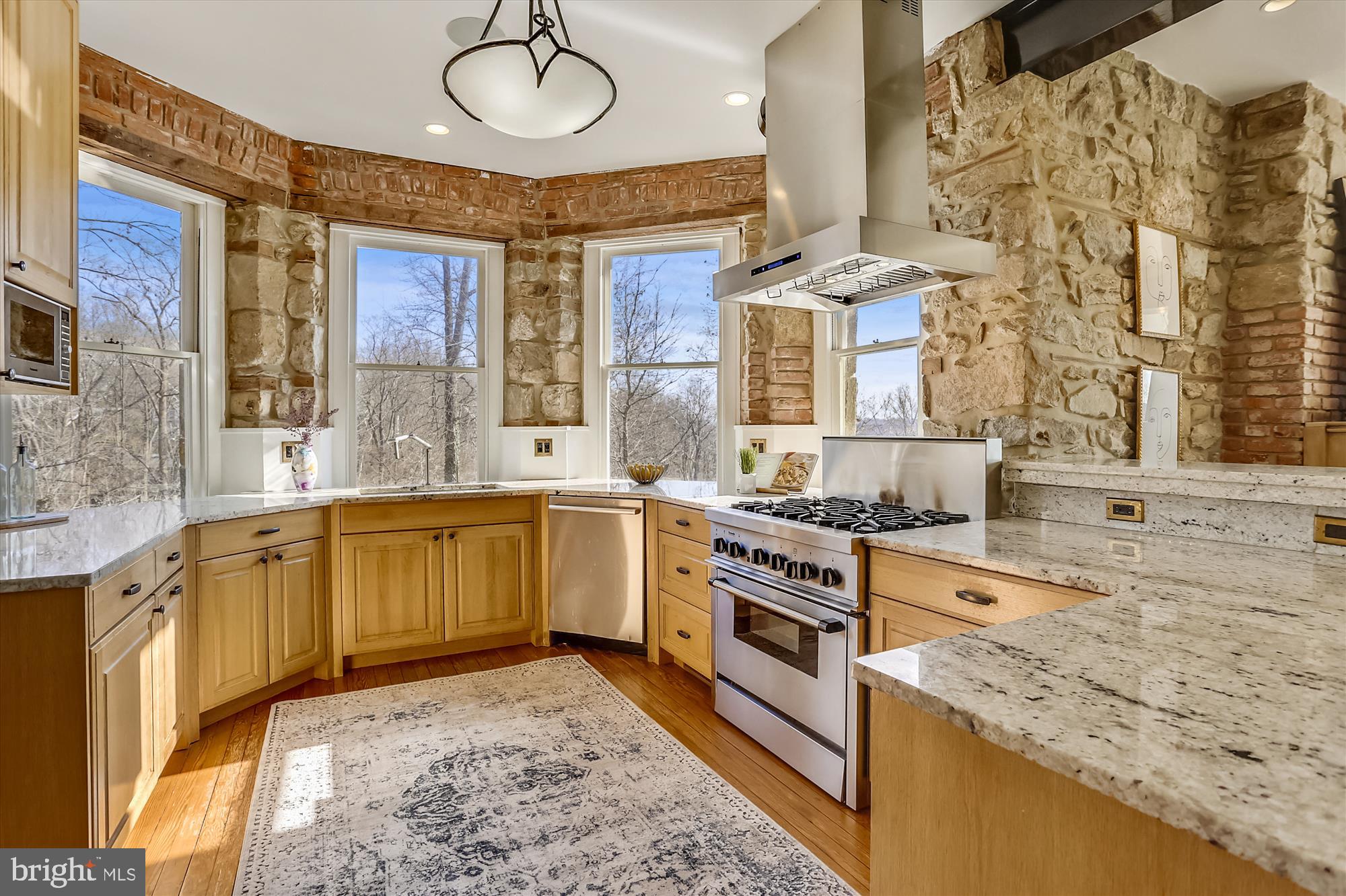 5417 Mohican Road Bethesda, MD 20816 - Photo 13 of 100 a kitchen with stainless steel appliances granite countertop a stove a sink and a microwave