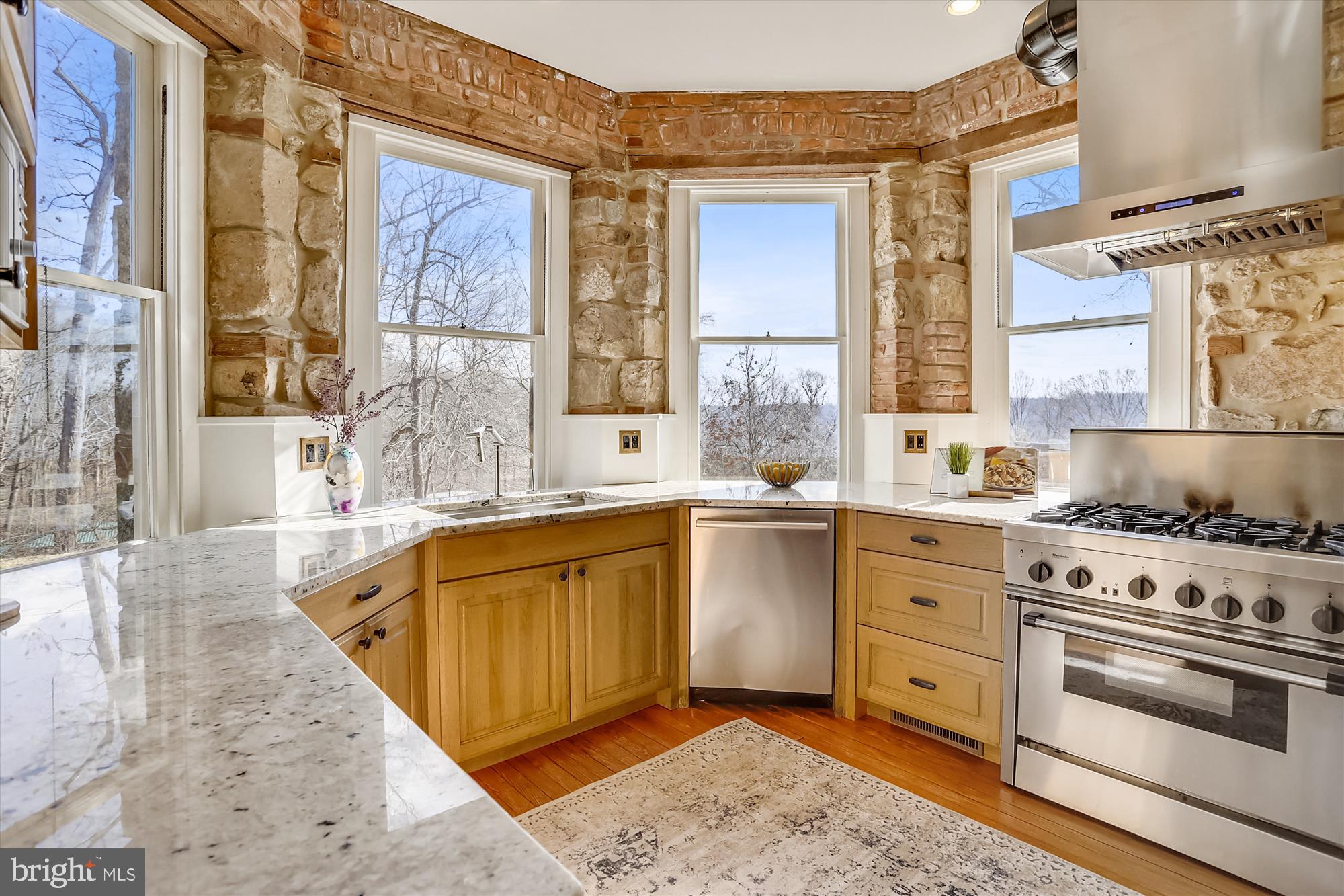 5417 Mohican Road Bethesda, MD 20816 - Photo 16 of 100 a kitchen with stainless steel appliances granite countertop a stove and a sink