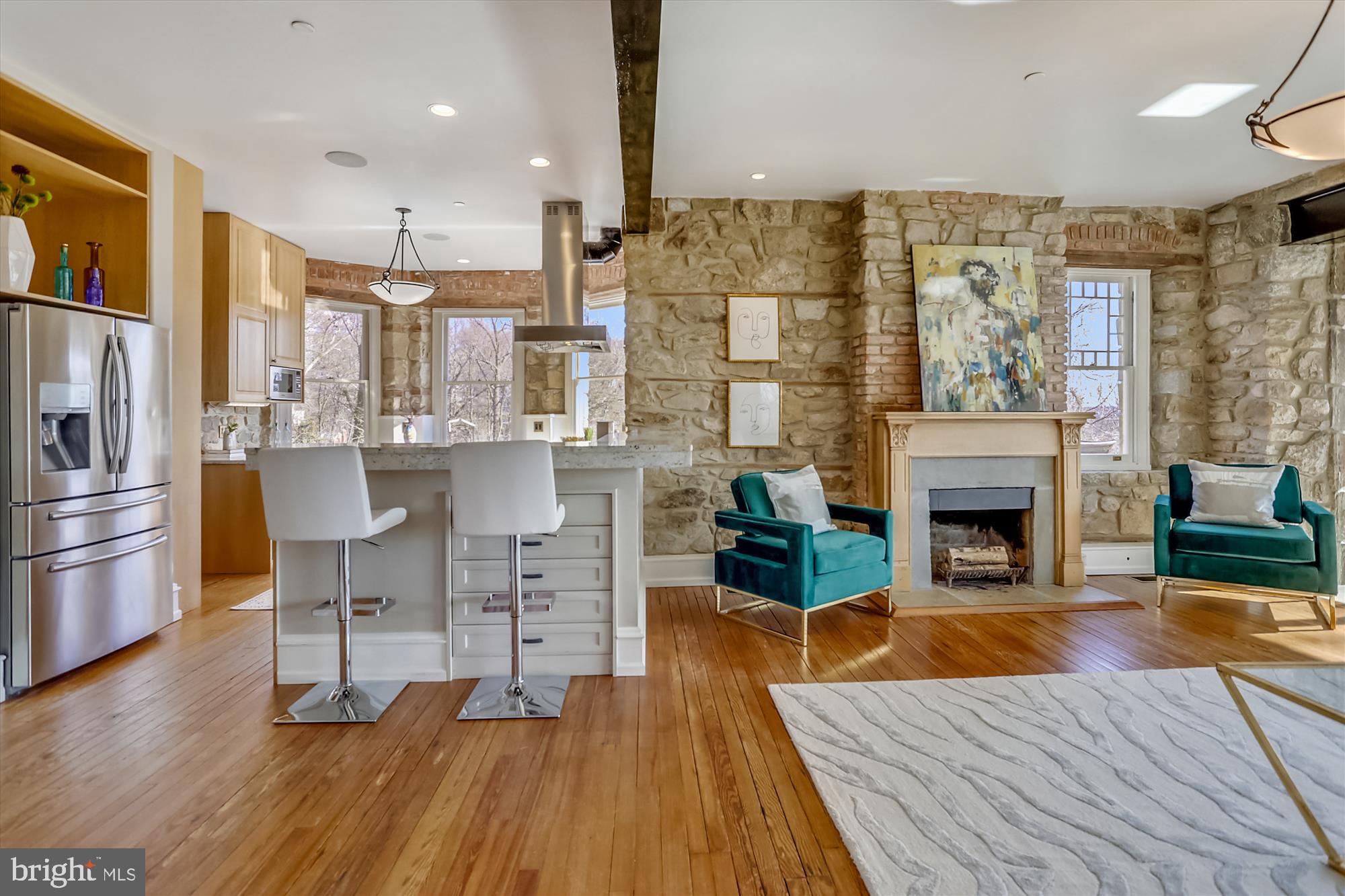 5417 Mohican Road Bethesda, MD 20816 - Photo 100 of 100 a living room with furniture wooden floor and a fireplace