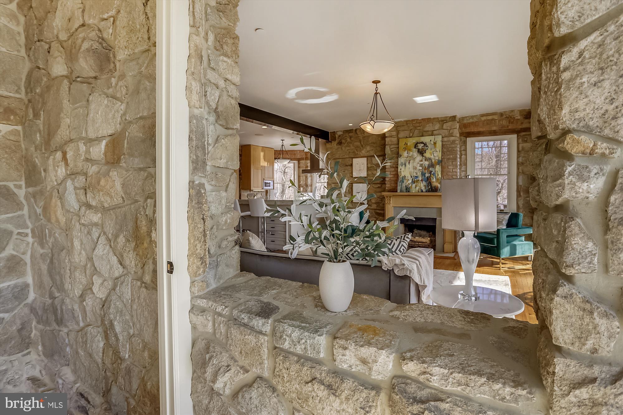 5417 Mohican Road Bethesda, MD 20816 - Photo 33 of 100 a view of a porch with chairs potted plants and floor to ceiling window