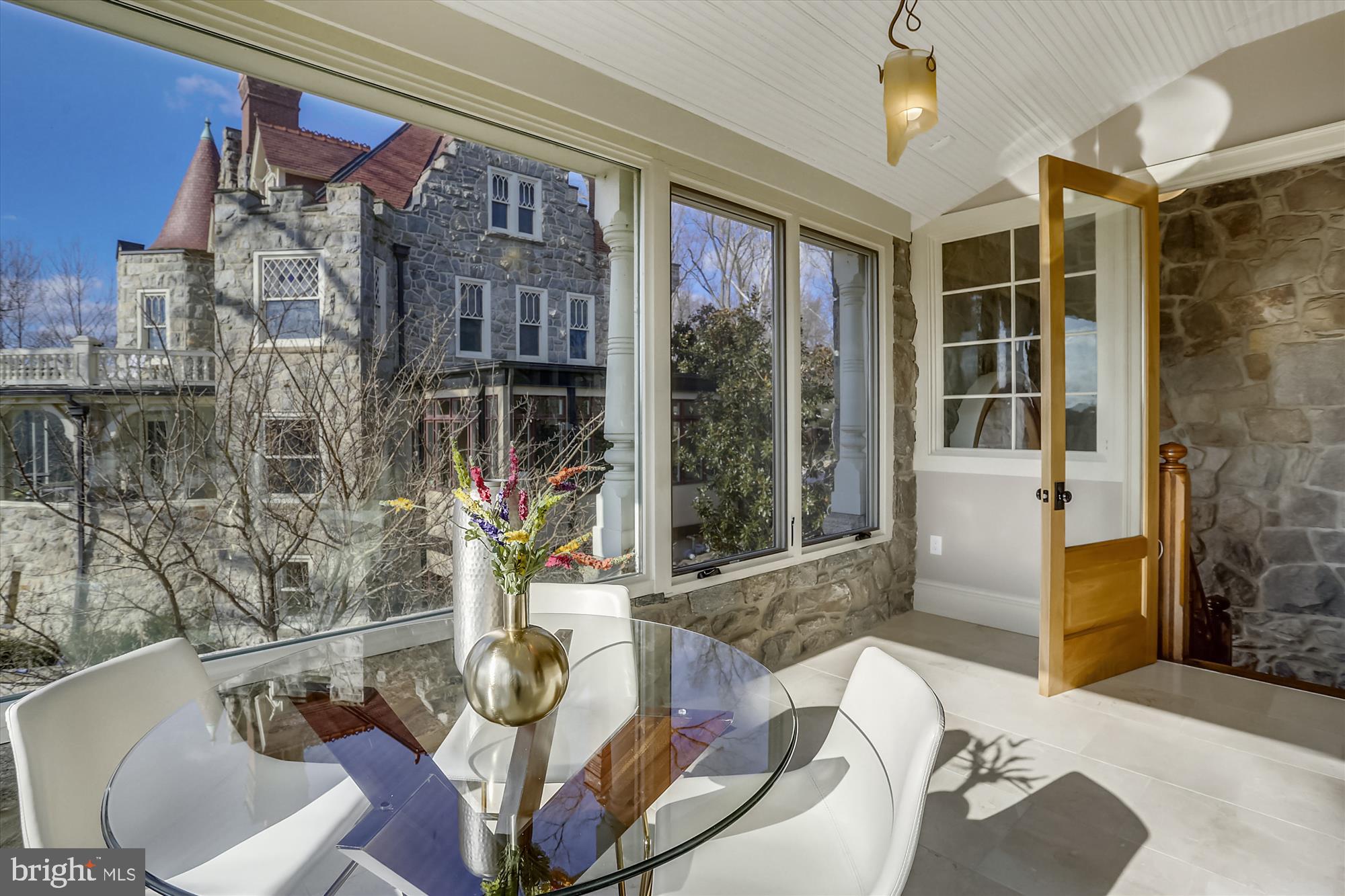 5417 Mohican Road Bethesda, MD 20816 - Photo 34 of 100 a living room with furniture and a floor to ceiling window