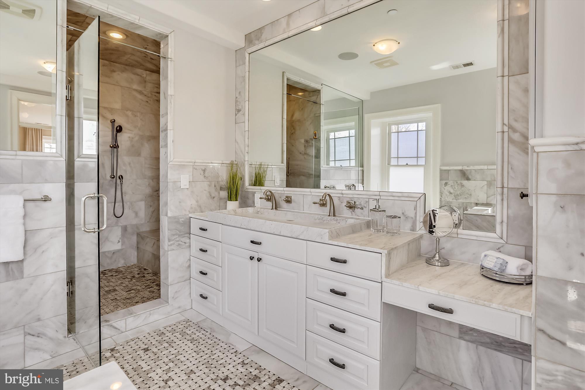 5417 Mohican Road Bethesda, MD 20816 - Photo 47 of 100 a bathroom with a double vanity sink mirror and shower