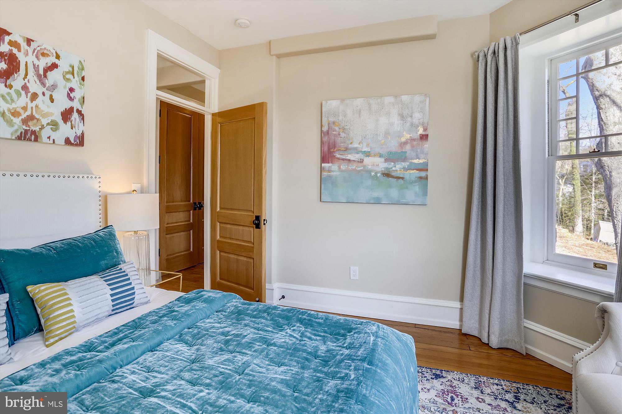 5417 Mohican Road Bethesda, MD 20816 - Photo 52 of 100 a bedroom with a bed and a painting on the wall