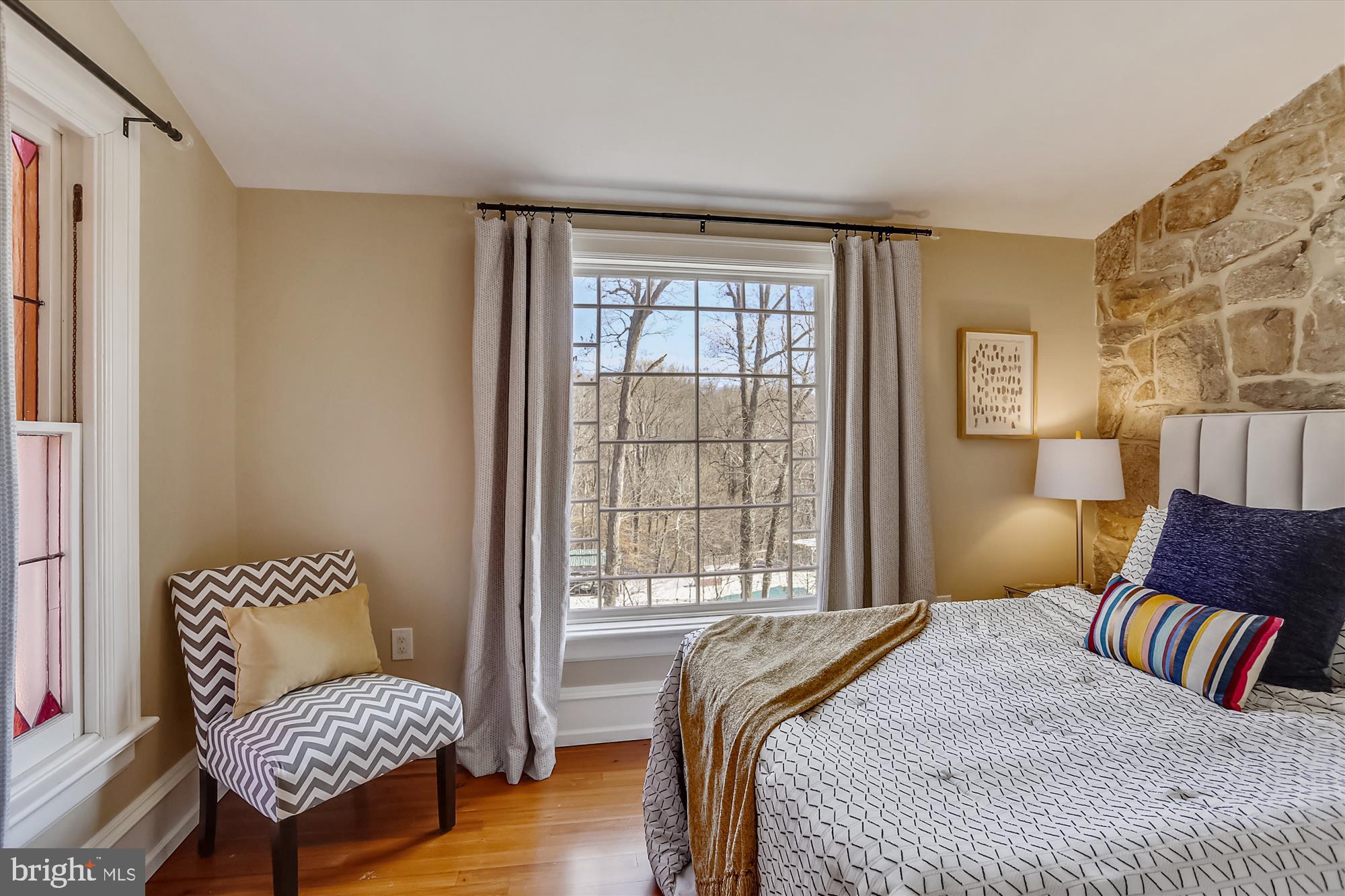 5417 Mohican Road Bethesda, MD 20816 - Photo 57 of 100 a bedroom with a bed and wooden floor