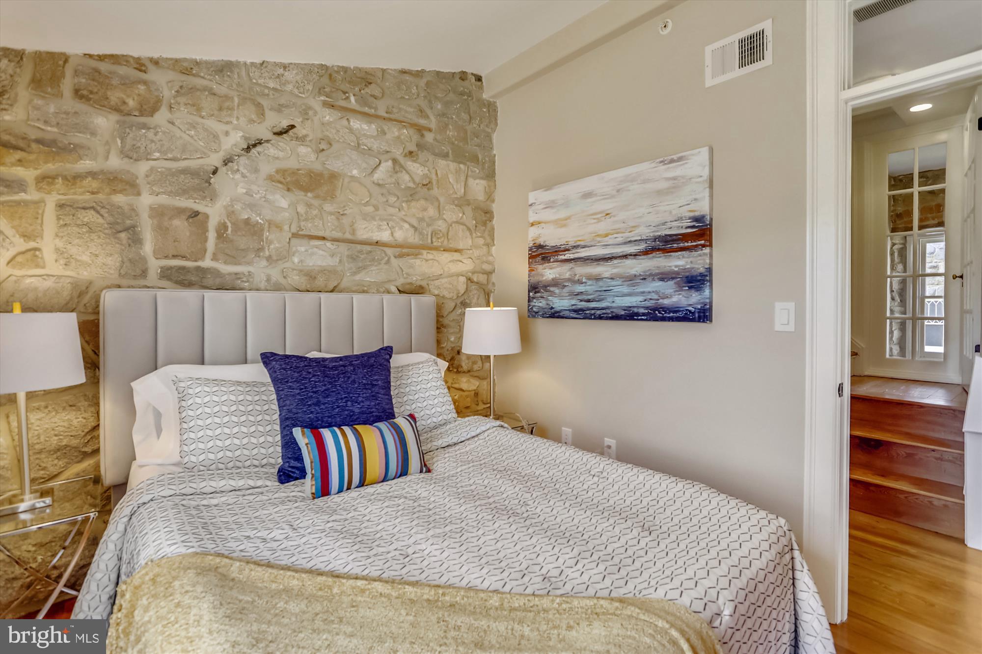 5417 Mohican Road Bethesda, MD 20816 - Photo 59 of 100 a bedroom with a bed and wooden floor