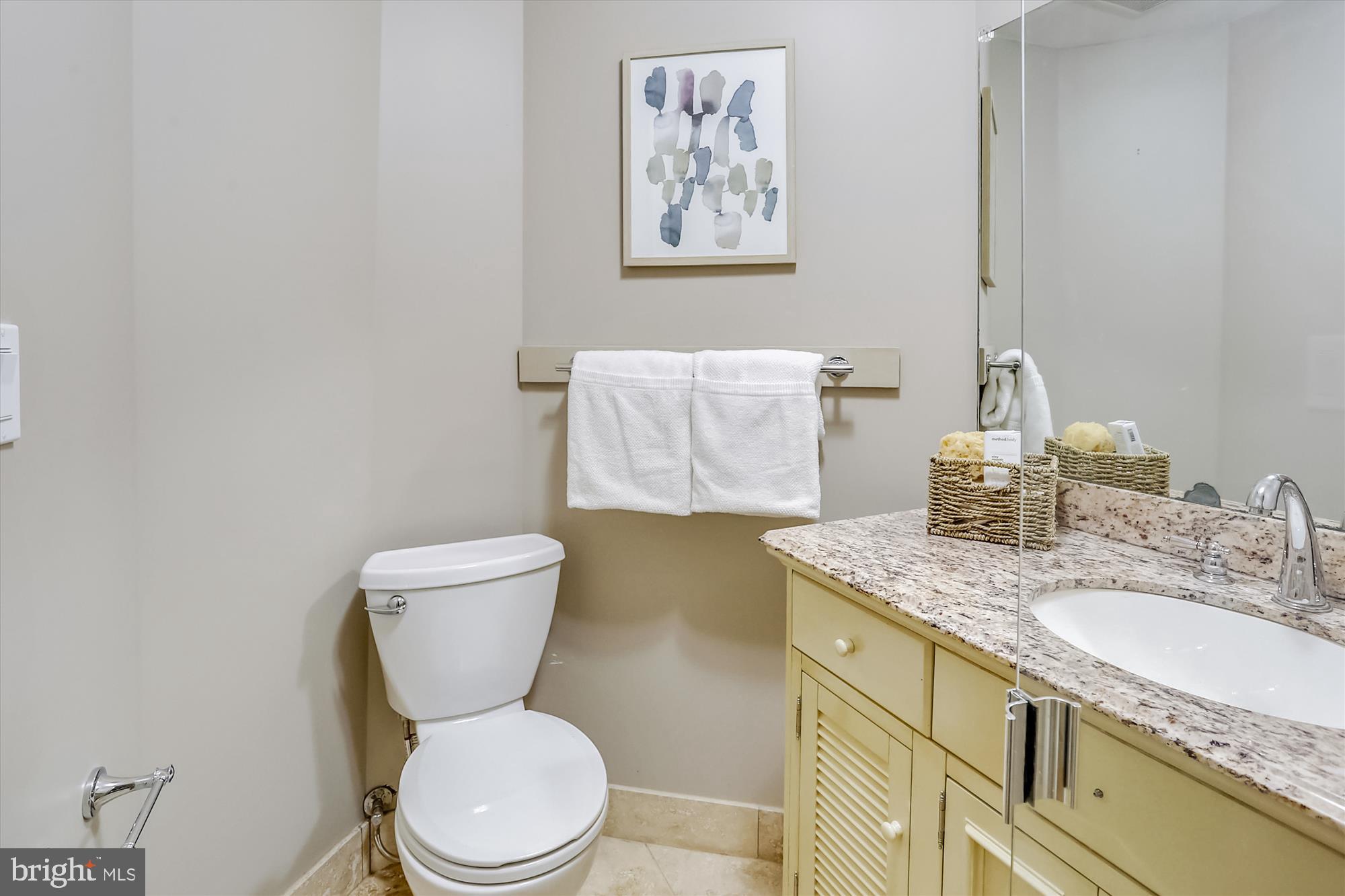 5417 Mohican Road Bethesda, MD 20816 - Photo 81 of 100 a bathroom with a granite countertop toilet sink and mirror