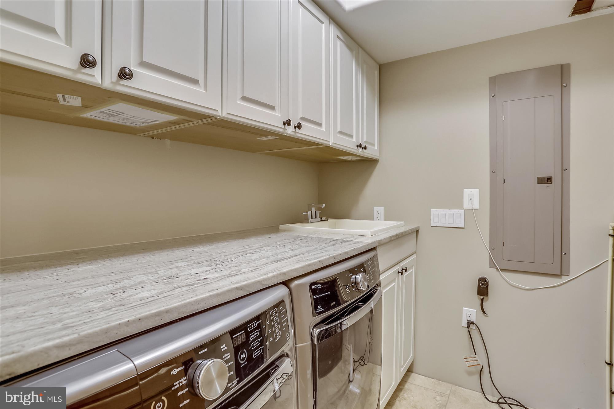 5417 Mohican Road Bethesda, MD 20816 - Photo 89 of 100 a kitchen with granite countertop a stove and a white cabinets