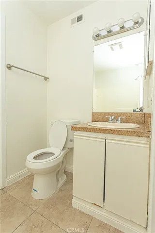 a bathroom with a toilet a sink and a shower