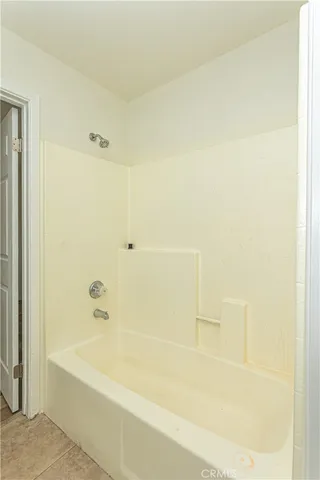 a view of a house with a yard and a fountain