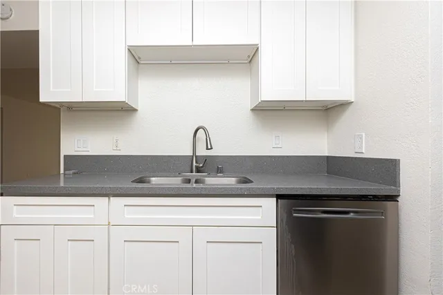 a kitchen with appliances cabinets and a counter top