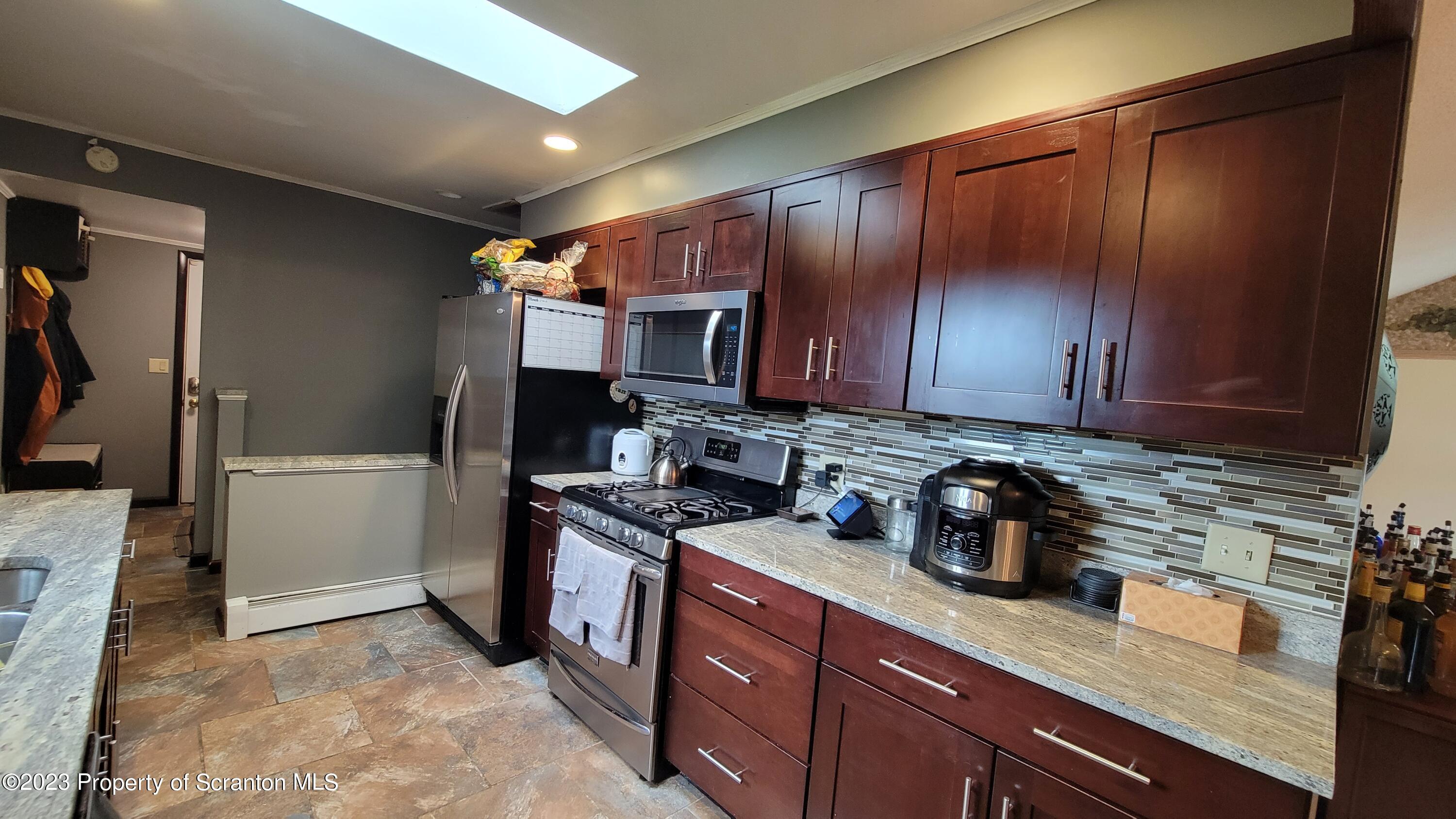 618 Kennedy Road Brackney, PA 18812 - Photo 11 of 35 a kitchen with sink a stove and cabinets