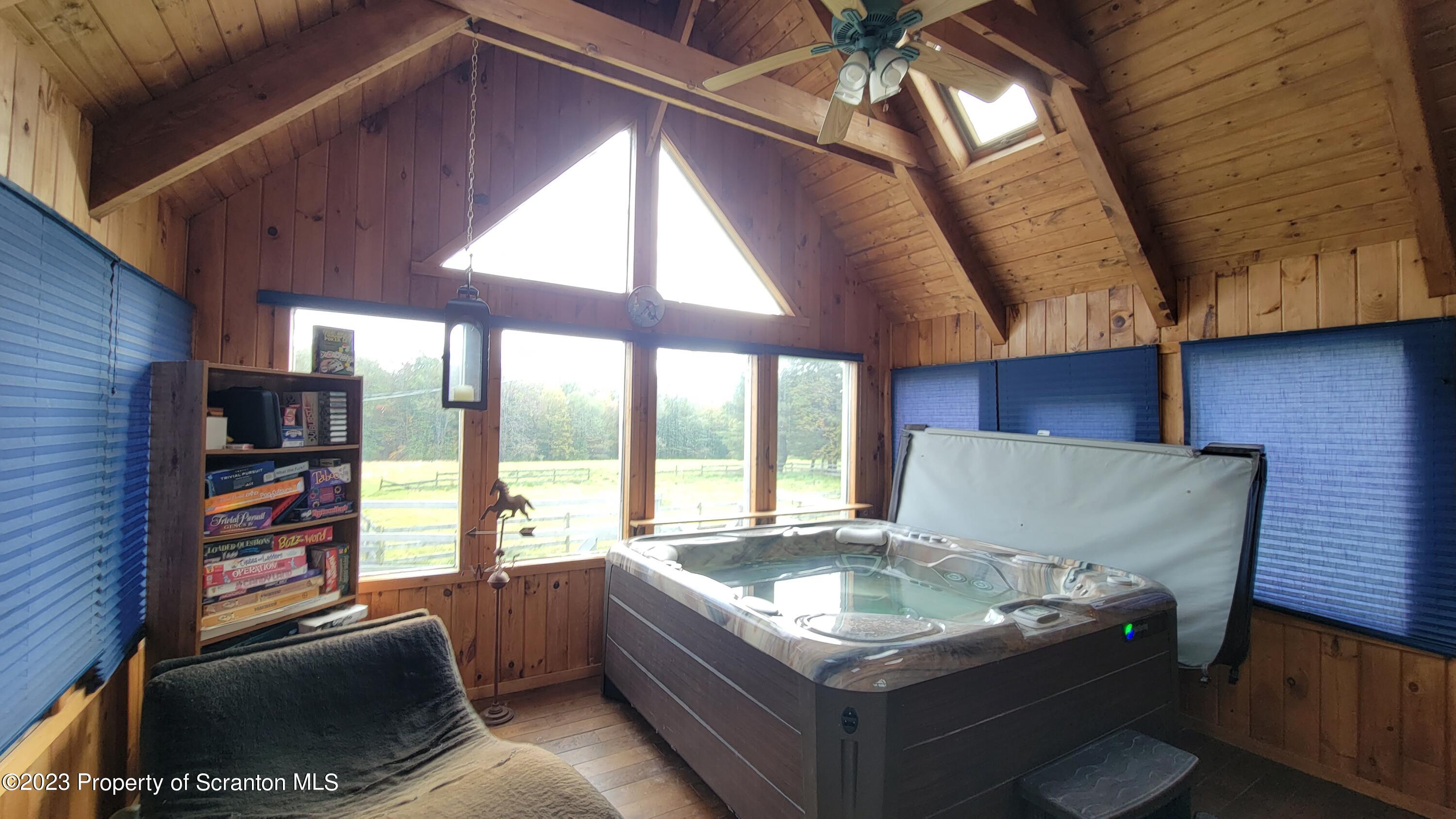 618 Kennedy Road Brackney, PA 18812 - Photo 18 of 35 a living room with furniture and a flat screen tv