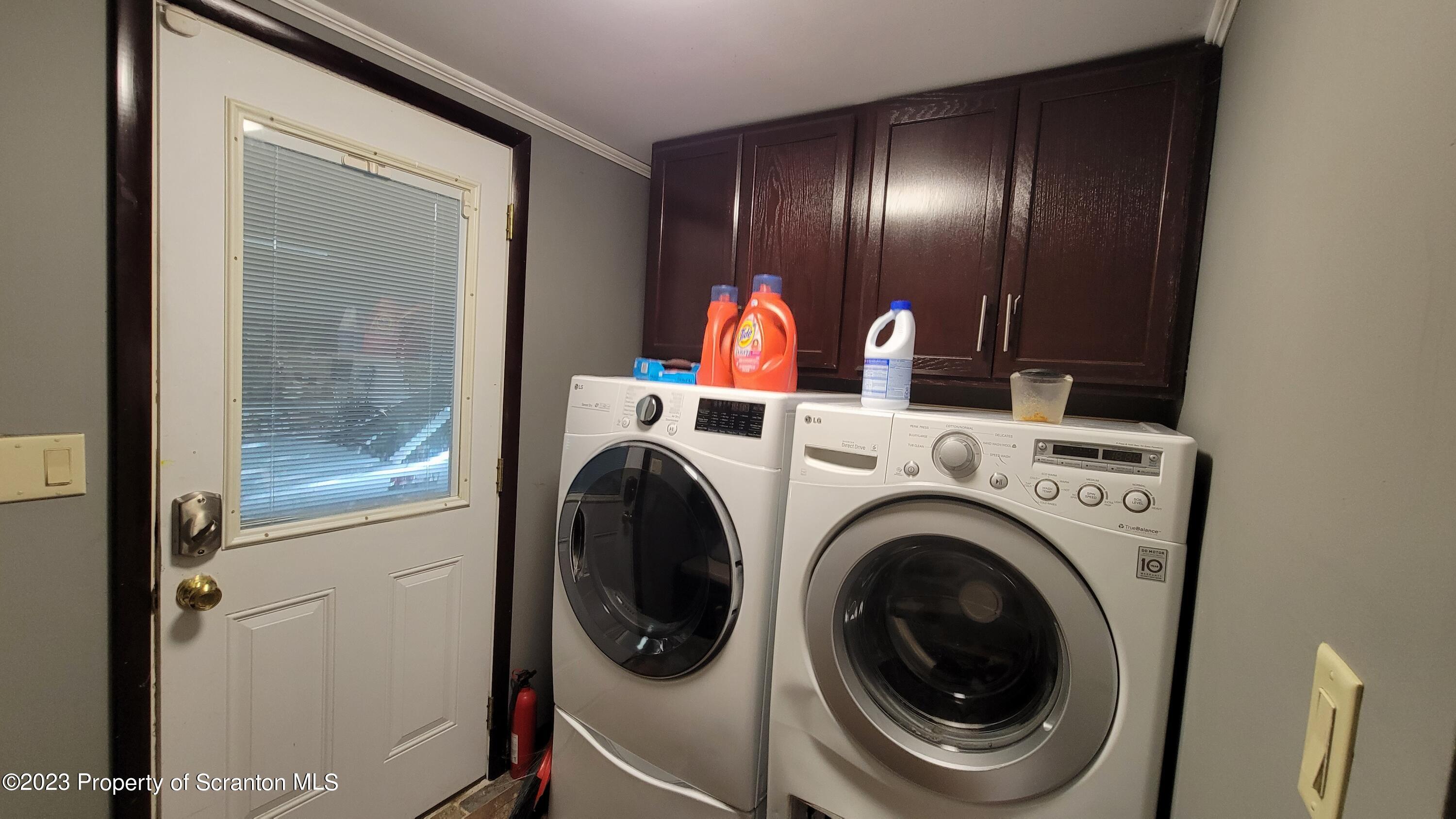 618 Kennedy Road Brackney, PA 18812 - Photo 19 of 35 a view of a hallway with washer and dryer
