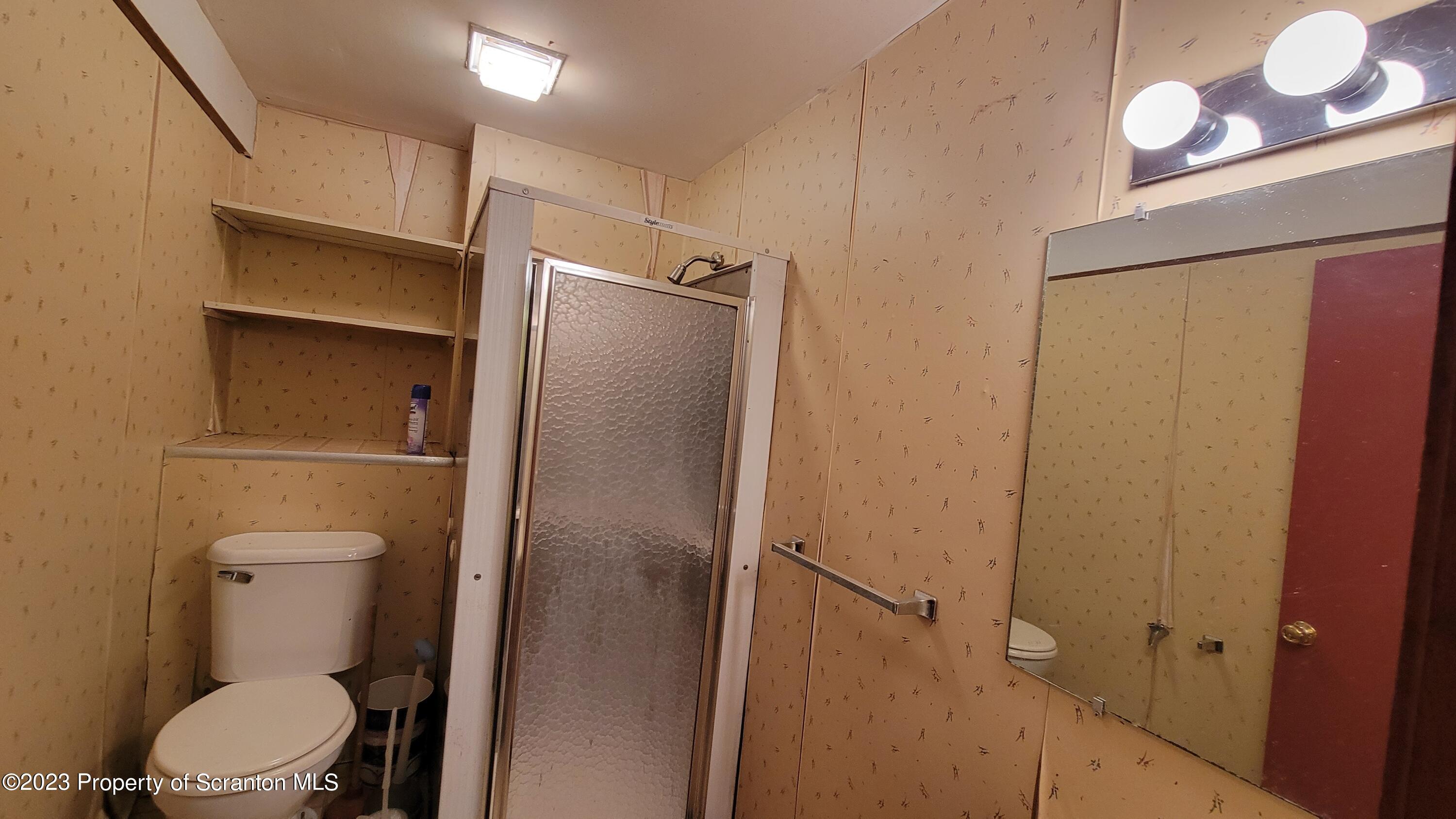 618 Kennedy Road Brackney, PA 18812 - Photo 28 of 35 a bathroom with a toilet and a shower