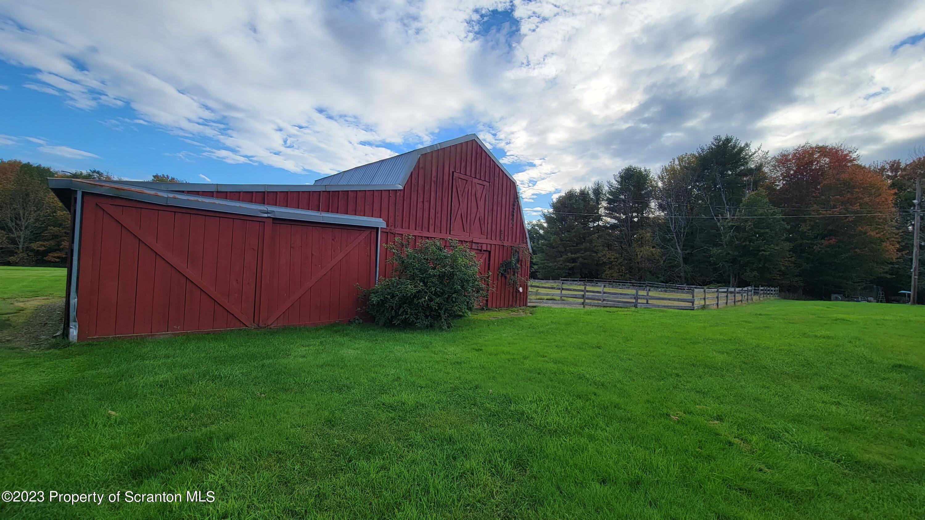 618 Kennedy Road Brackney, PA 18812 - Photo 30 of 35 a backyard of a house with lots of green space