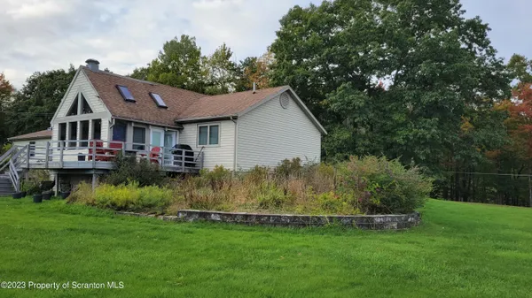 a view of a house with a big yard