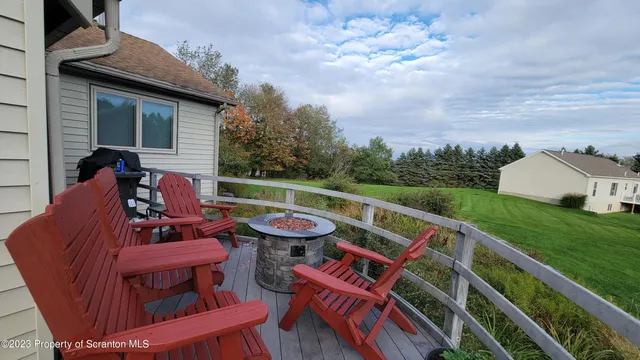 a view of balcony with furniture and city view