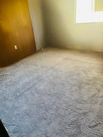 a view of empty room with windows