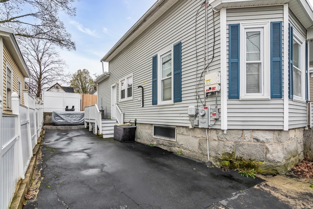 42 D Street Lowell, MA 01851 - Photo 2 of 27 a view of a house with a yard