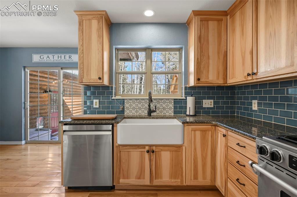 284 County Road 511 Divide, CO 80814 - Photo 15 of 49 a kitchen with granite countertop a sink and a stove
