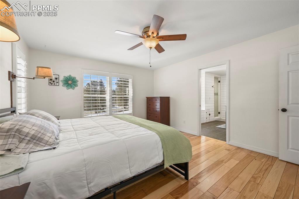 284 County Road 511 Divide, CO 80814 - Photo 20 of 49 a bedroom with a bed and dresser with wooden floor