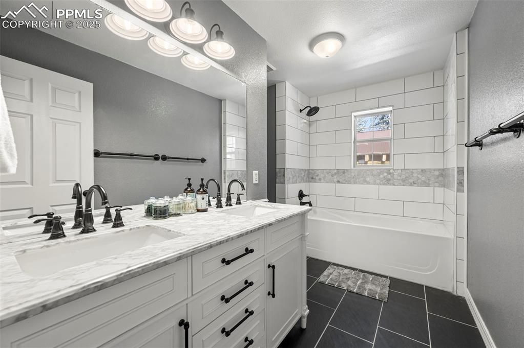 284 County Road 511 Divide, CO 80814 - Photo 26 of 49 a bathroom with a sink double vanity and a mirror