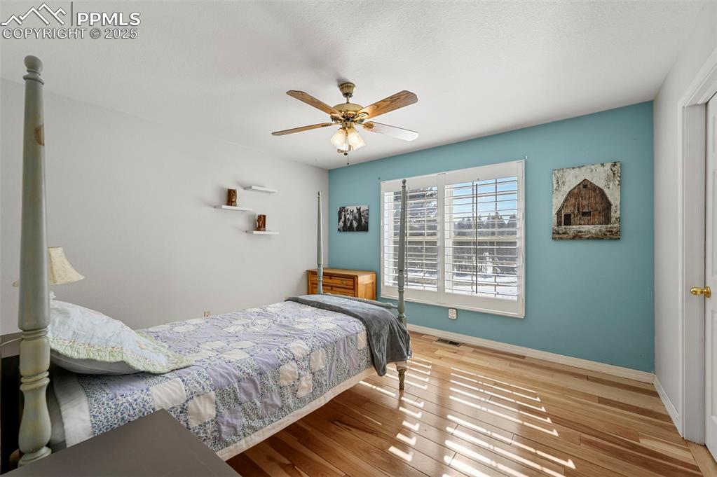 284 County Road 511 Divide, CO 80814 - Photo 28 of 49 a bedroom with a bed a dresser and a window