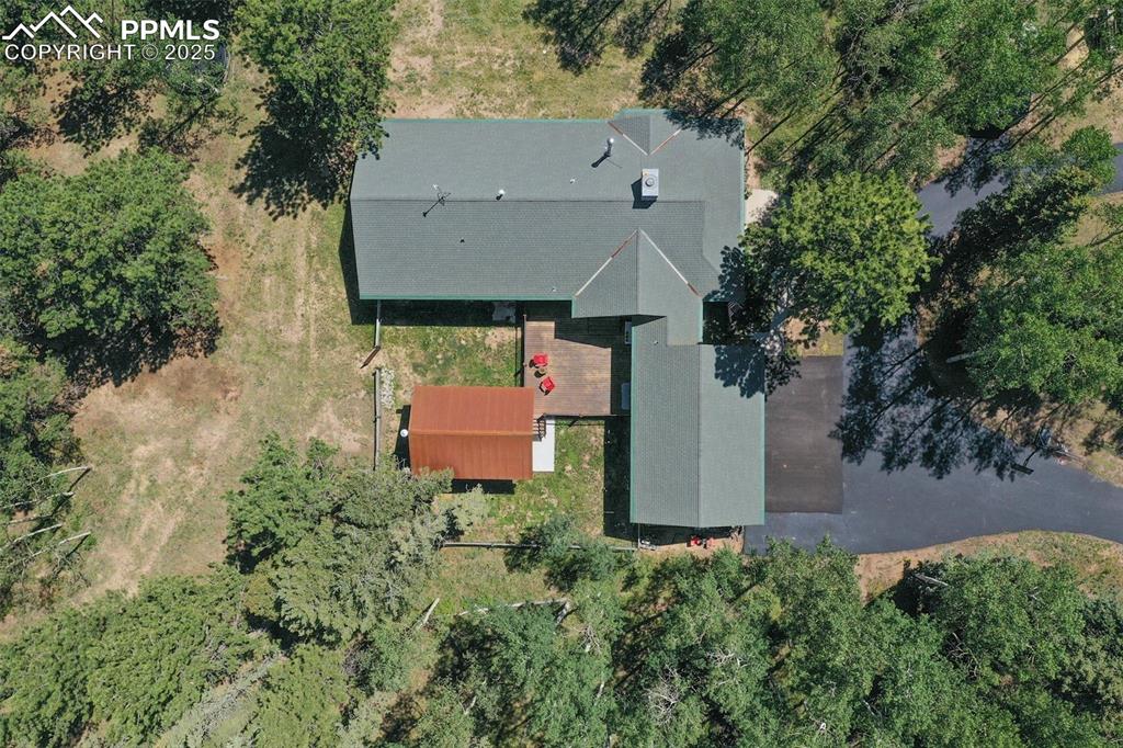 284 County Road 511 Divide, CO 80814 - Photo 47 of 49 an aerial view of a house with yard and trees all around