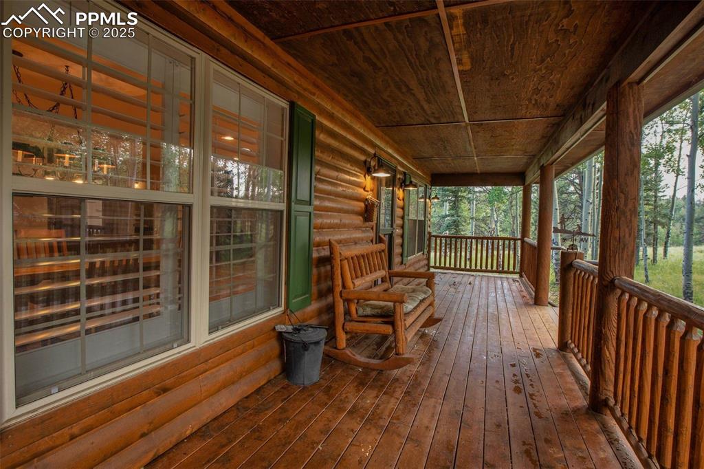 284 County Road 511 Divide, CO 80814 - Photo 5 of 49 a view of a room with wooden floor and iron stairs