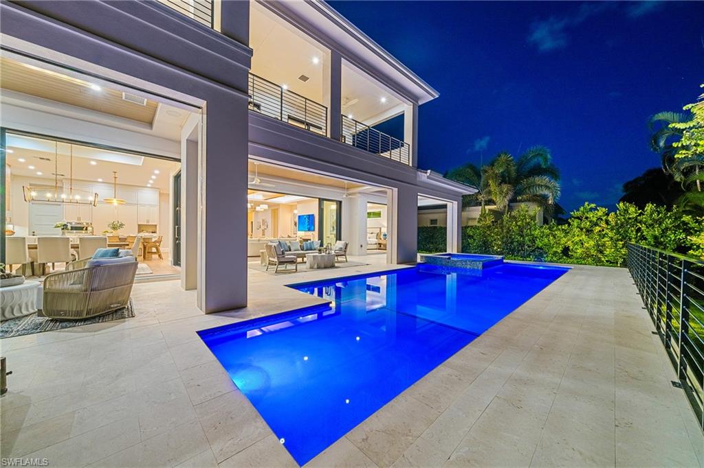 448 Devils Lane Naples, FL 34103 - Photo 13 of 15 a living room with furniture with potted plants