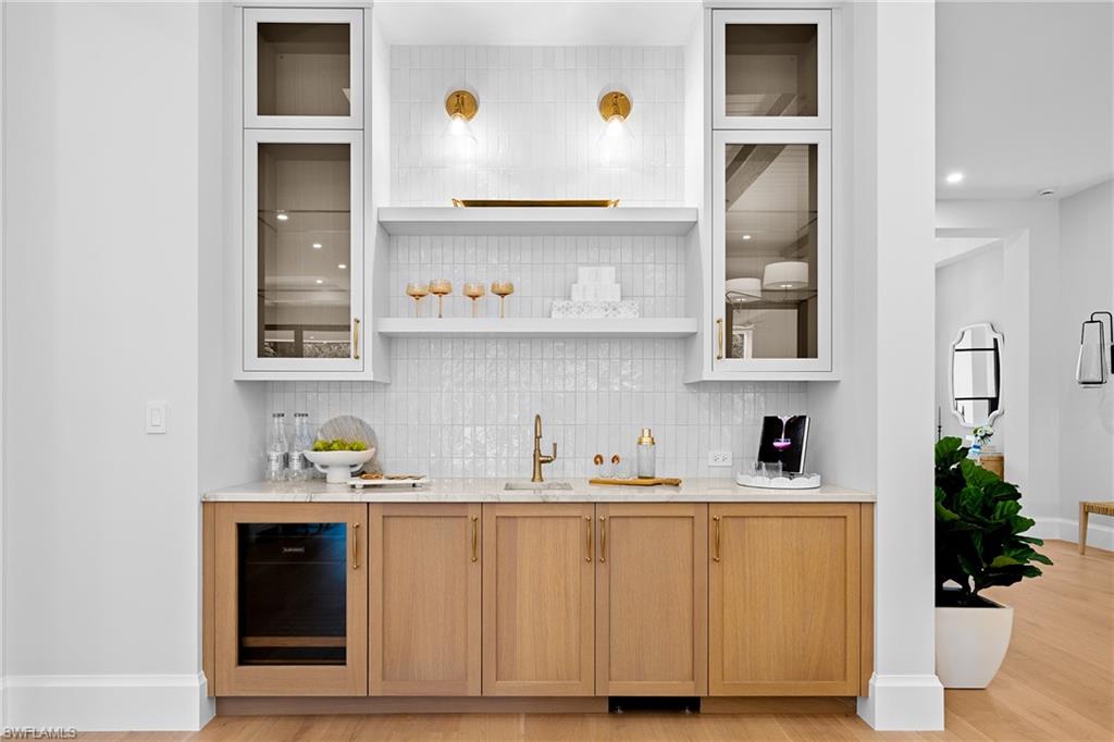 448 Devils Lane Naples, FL 34103 - Photo 5 of 15 a kitchen with stainless steel appliances a sink and cabinets