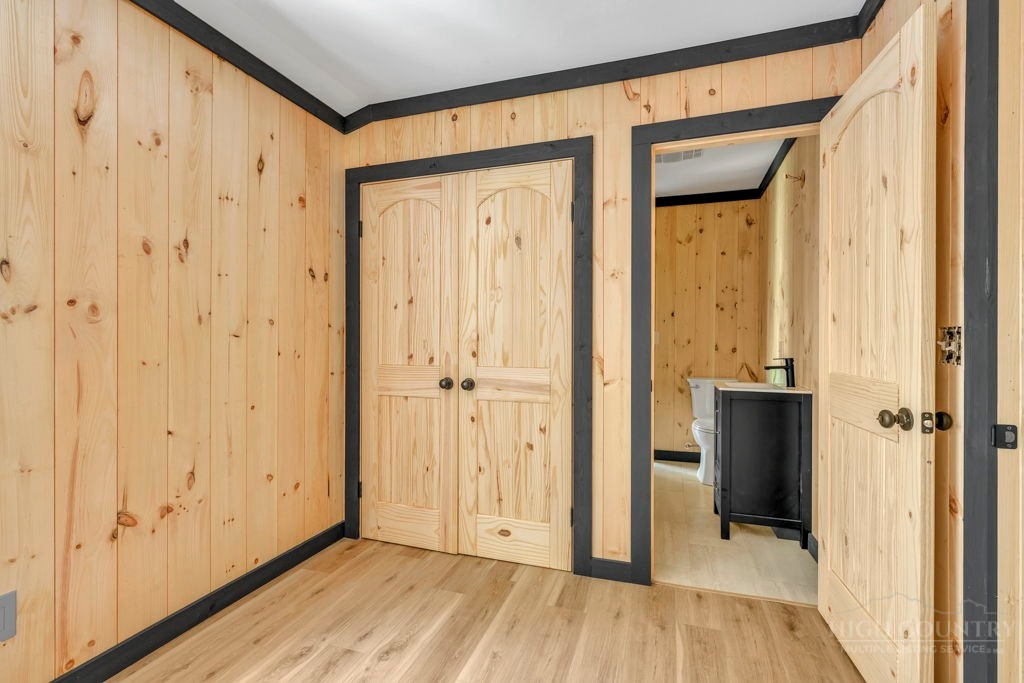 209 Meadow Loop Newland, NC 28657 - Photo 16 of 30 a view of a hallway with wooden floor and closet area