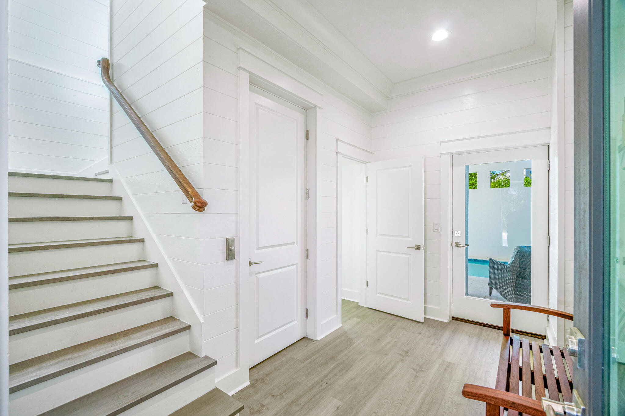 40 Cote D Azur Drive Santa Rosa Beach, FL 32459 - Photo 31 of 92 a view of a hallway with wooden floor and stairs