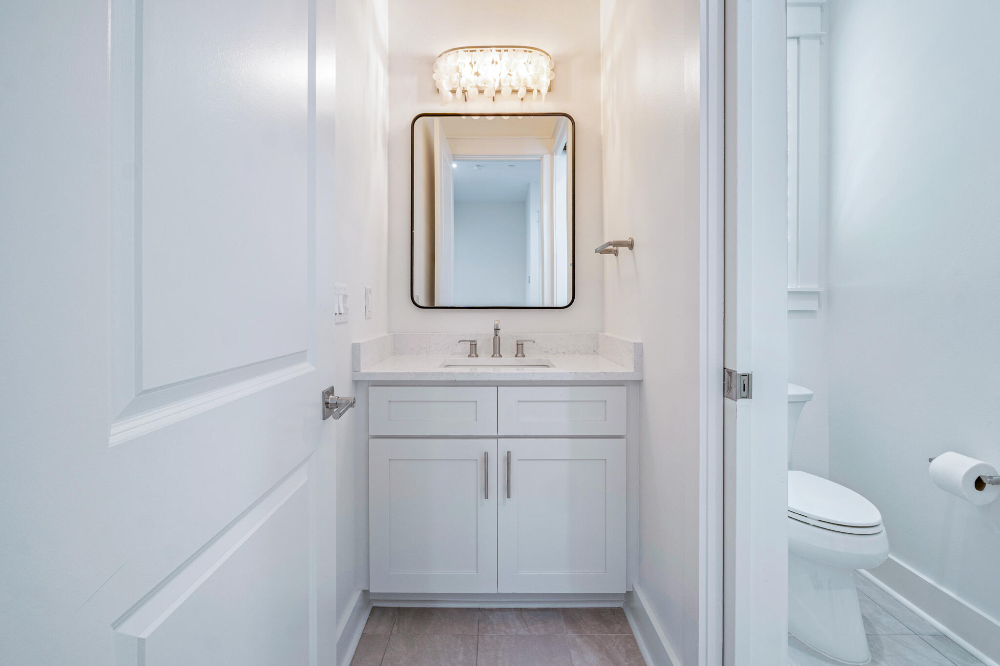 40 Cote D Azur Drive Santa Rosa Beach, FL 32459 - Photo 63 of 92 a bathroom with a toilet sink and mirror